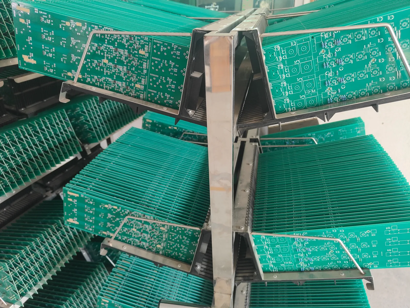 Audio equipment circuit boards organized on production racks